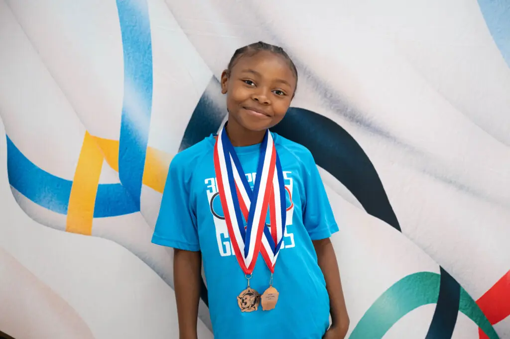 A student in Detroit celebrates Olympic Pride at Comcast digital inclusion event.