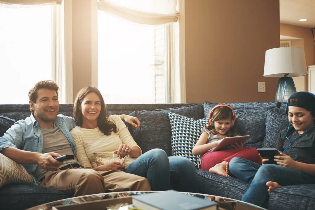 Family enjoying superfast Xfinity internet with Xfinity mobile hotspots supplying connectivity for multiple devices.