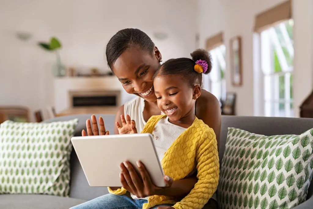 Customers on their electronic devices enjoying the Xfinity speed increase for Michigan, including a free speed upgrade for uploads and downloads of data.