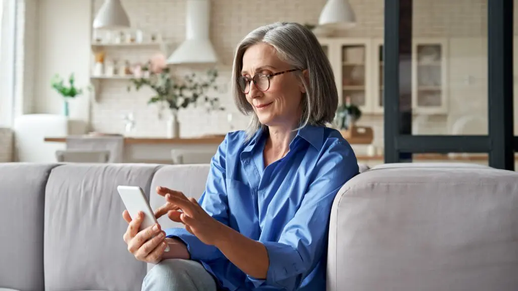 Woman spring cleaning apps on her phone