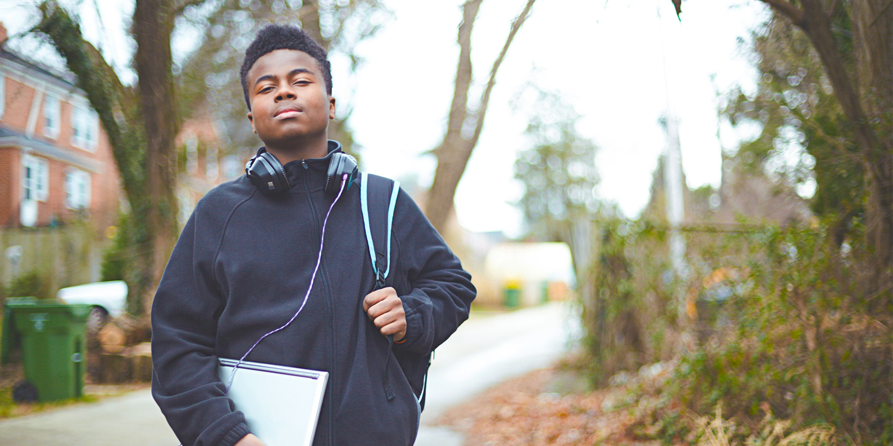 Young student with a device for digital learning and digital skill development.