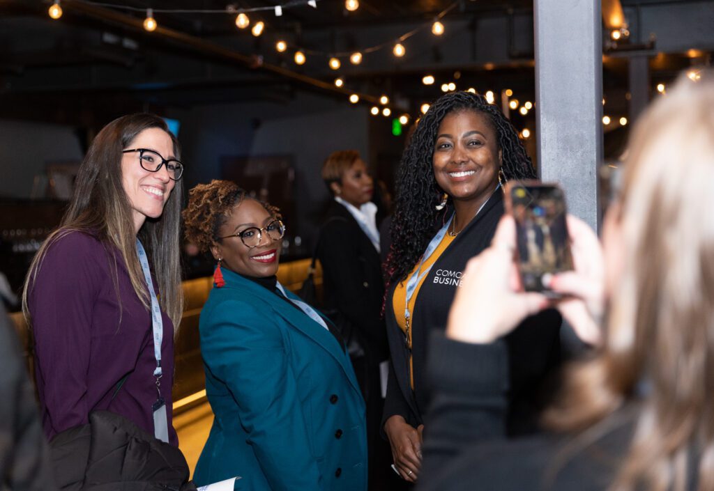 Detroit Comcast RISE recipients and a Comcast Business representative pose for a photo.