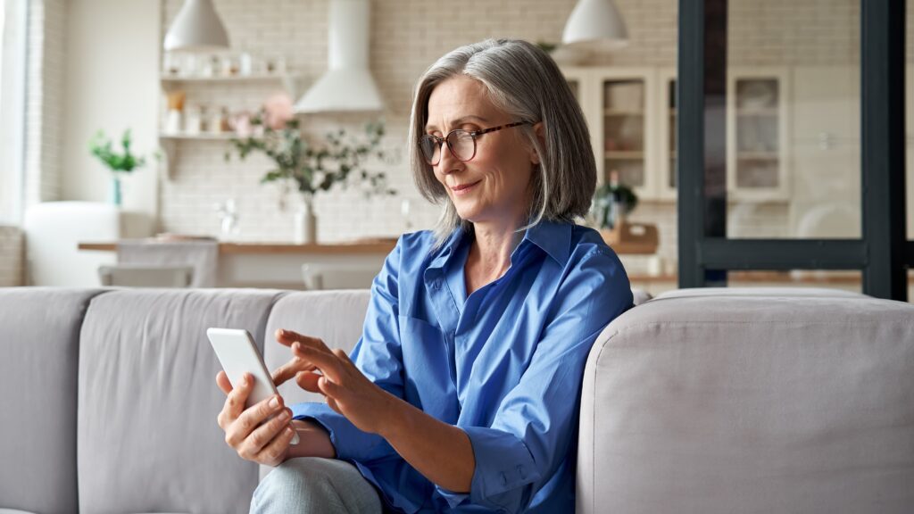 Woman spring cleaning apps on her phone