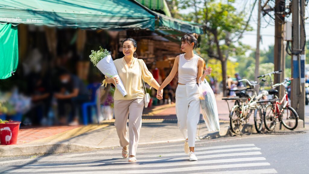 Two women at a crosswalk