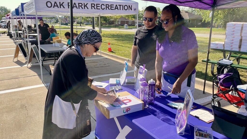 Comcast donates laptops at the Oak Park Farmer's Market