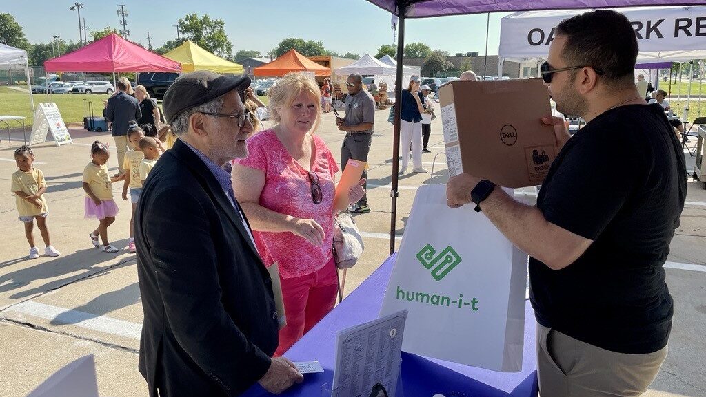 Comcast donates laptops at the Oak Park Farmer's Market